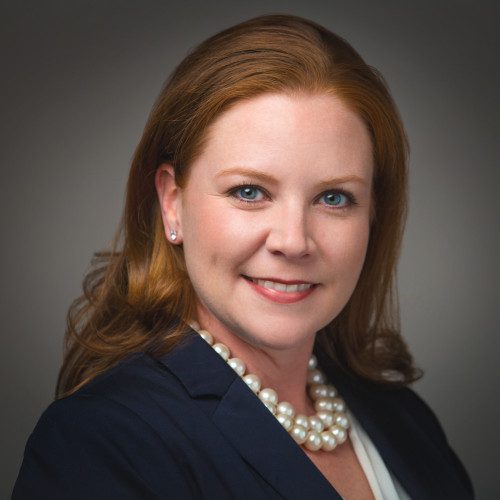 Headshot of Leslie A against a grey background