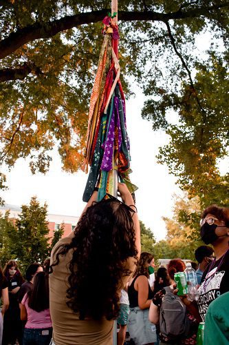 tying ribbons on poles