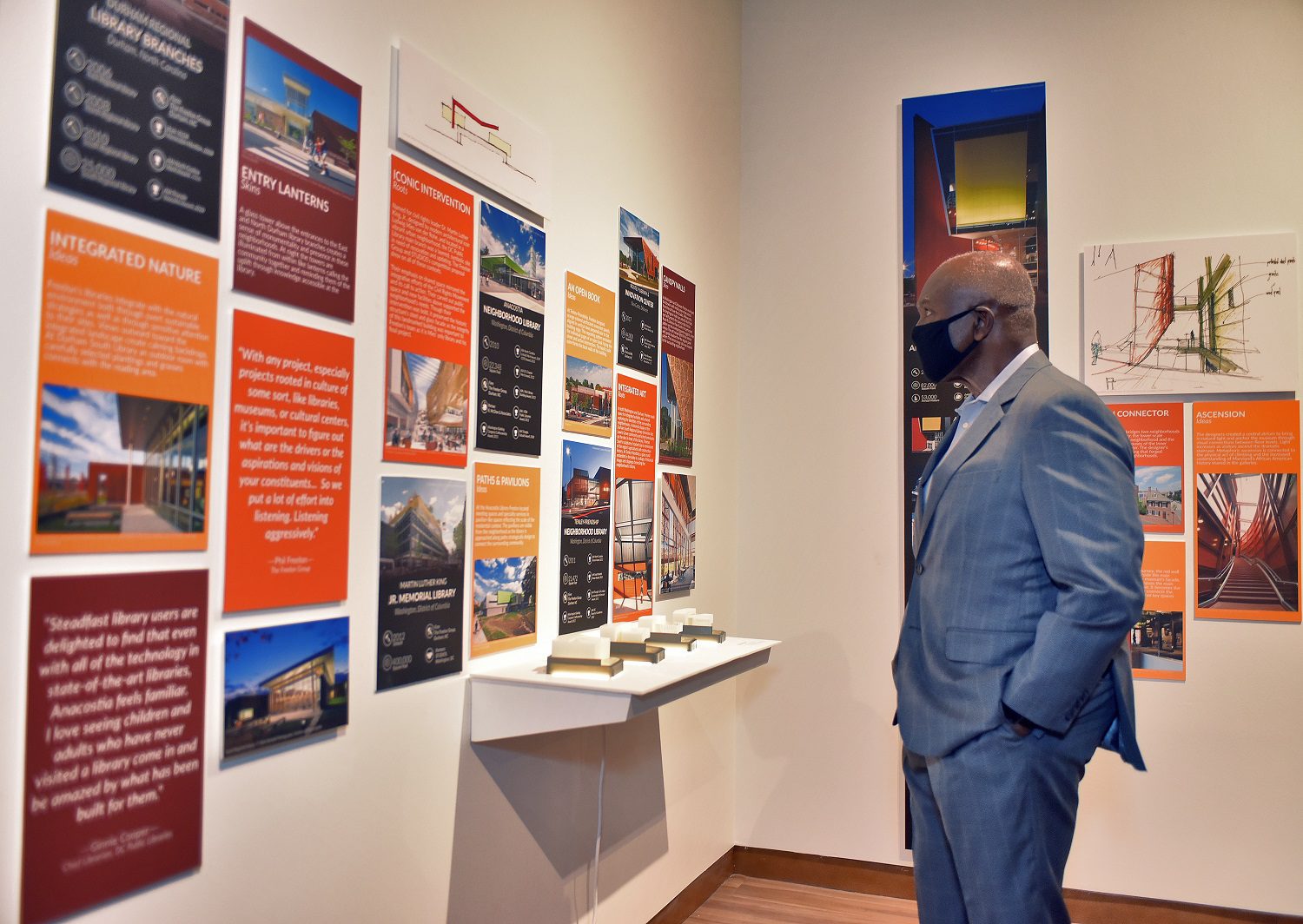 Harvey Gantt looking at exhibition