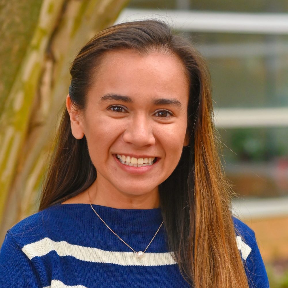 Kirstin Sheldon headshot outside of Storrs