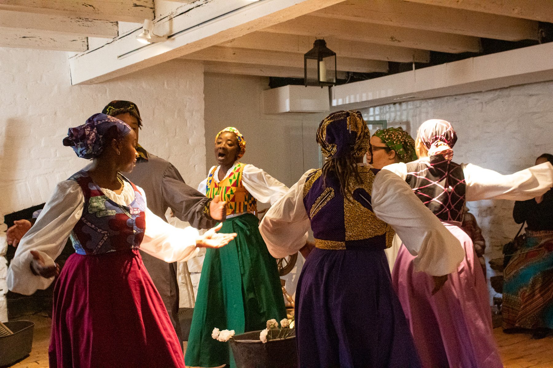 students dancing inside historic home