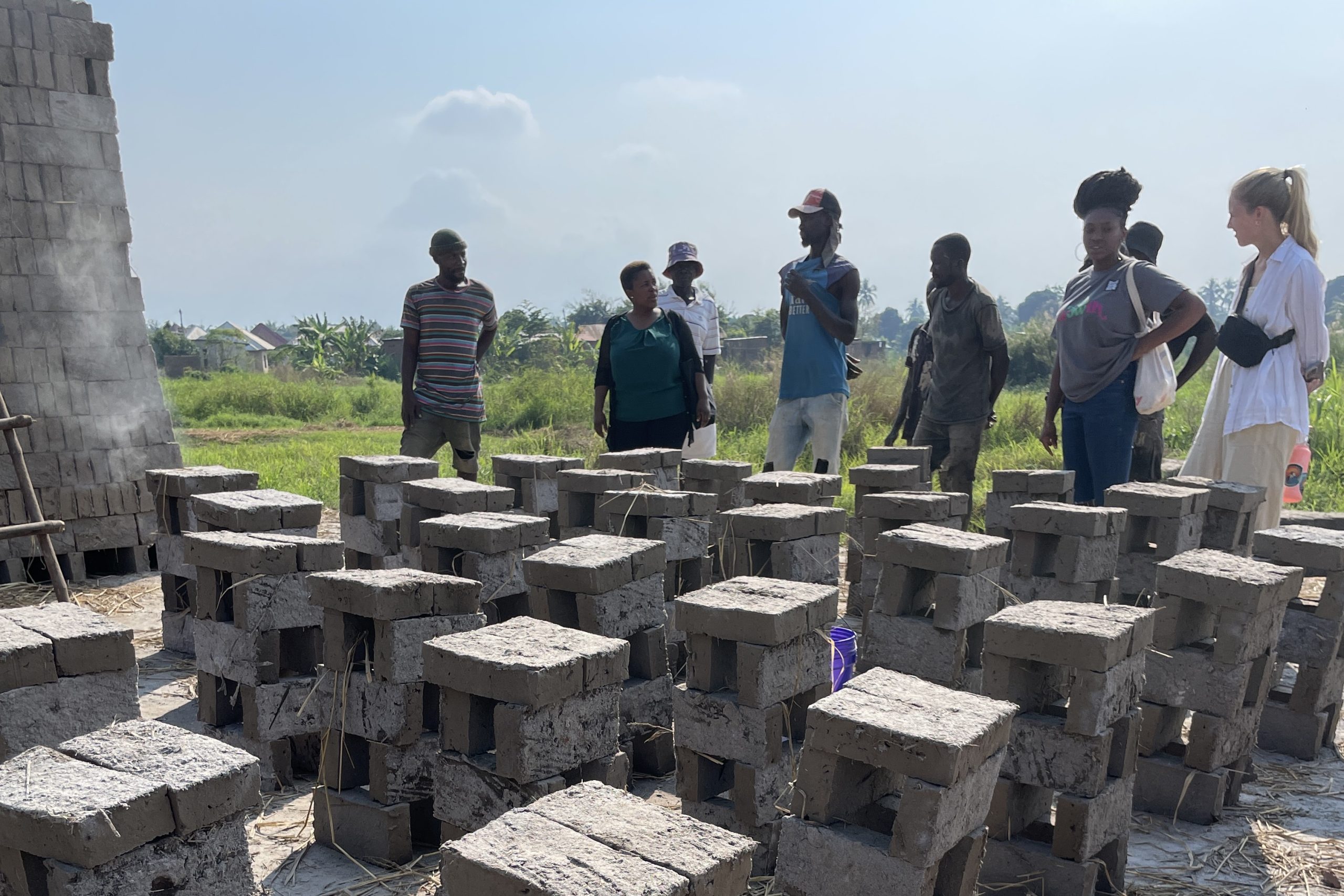students in Tanzania with bricks outdoors